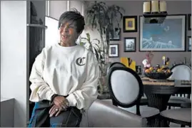  ?? TERRENCE ANTONIO JAMES/CHICAGO TRIBUNE ?? Rosita Wood sits in her apartment in the Kenwood neighborho­od. She has been keeping busy during the stay-at-home order, but had to cancel plans for internatio­nal travel.