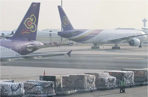  ?? SOMCHAI POOMLARD ?? Cargo at Suvarnabhu­mi airport. Improved world trade has given the global air freight market a strong boost.