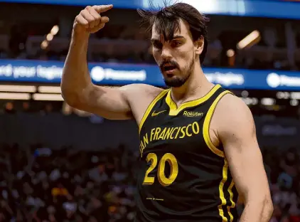  ?? Stephen Lam/The Chronicle ?? Forward Dario Saric, who’s dealing with an illness, wasn’t with the Warriors when they began a five-game road trip with a matchup against the Grizzlies on Friday night.