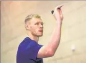  ?? ?? England goalkeeper Aaron Ramsdale plays darts before a press conference on Friday.