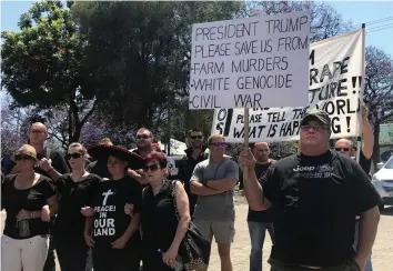  ?? HEIBERG/REUTERS Picture: TANISHA ?? CALL FOR ACTION: Protesters calling for the end of farm murders march to the US and Australian embassies in Pretoria in October.