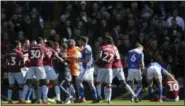  ?? NICK POTTS - THE ASSOCIATED PRESS ?? A fan is removed after attacking Aston Villa’s Jack Grealish, right, on the pitch during the Sky Bet Championsh­ip soccer match at St Andrew’s Trillion Trophy Stadium, Birmingham, England, Sunday March 10, 2019.