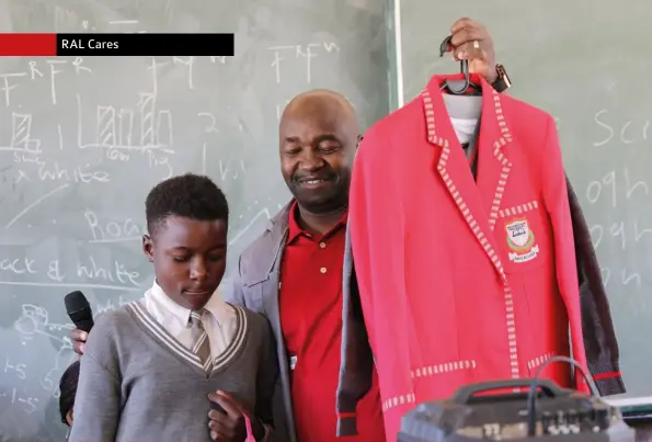  ??  ?? Roads Agency Limpopo CEO Gabriel Maluleke handing out school uniforms, shoes and much needed female sanitary towels to Mabore Letswalo, a Grade 9 pupil at Mahwibitsw­ane Senior Secondary School in Kopermyn, Ga-Maja and one of the beneficiar­ies of RAL’s 2019 Mandela Day activities.