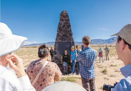  ?? JOHN BURCHAM/THE NEW YORK TIMES PHOTOS 2022 ?? Tourists visit the Trinity Site obelisk, which marks ground zero at White Sands Missile Range in New Mexico.