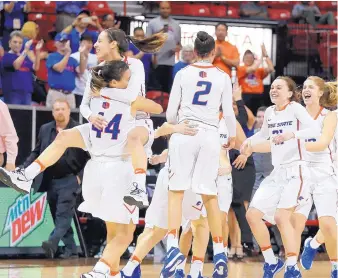  ?? ISAAC BREKKEN/ASSOCIATED PRESS ?? Boise State players react with jubilation after defeating Fresno State for the Mountain West Conference tournament championsh­ip Friday in Las Vegas, Nev. It is Boise State’s second tournament title in the past three seasons.