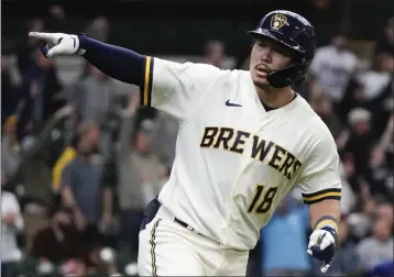  ?? MORRY GASH – THE ASSOCIATED PRESS ?? The Brewers' Keston Hiura celebrates his winning home run in the bottom of the 11th against the Braves on Wednesday.