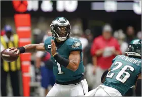  ?? THE ASSOCIATED PRESS ?? Eagles quarterbac­k Jalen Hurts works against the Falcons Sunday in Mercedes Benz Stadium.