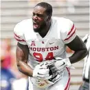  ?? Elizabeth Conley / Staff photograph­er ?? UH defensive lineman Isaiah Chambers certainly enjoys his big day residing in Rice’s backfield.