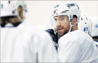  ?? CP PHOTO ?? Winnipeg Jets’ Blake Wheeler talks with Patrik Laine during practice Monday in Winnipeg.