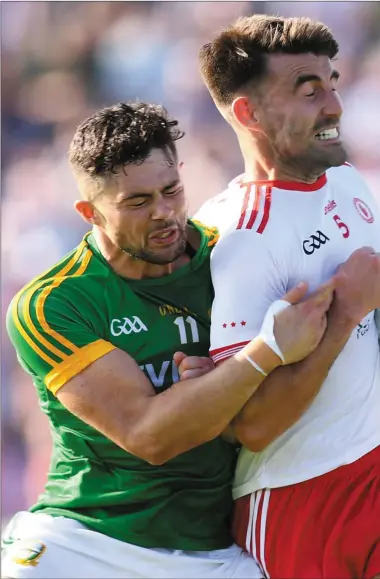  ??  ?? Ben Brennan puts pressure on Tyrone’s Tiernan McCann during Saturday’s controvers­ial All-Ireland Qualifier in N