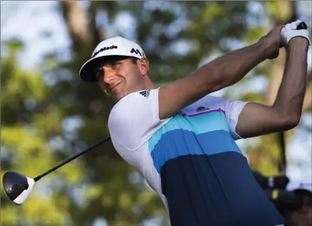  ?? MARK BLINCH, THE CANADIAN PRESS ?? Dustin Johnson tees off the 10th at the 2016 Canadian Open golf tournament in Oakville on Friday. He’s seven shots under after two rounds.