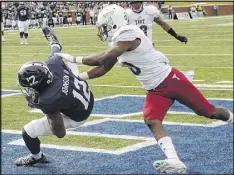  ?? TODD BENNETT / GETTY IMAGES ?? Georgia Southern wide receiver BJ Johnson pulls in a touchdown reception in front of Troy defensive back Tyquae Russell.