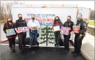  ?? Christian Abraham / Hearst Connecticu­t Media ?? The Clinton Police Department teams up with Clinton Social Services with the department’s Giving Tree at police headquarte­rs in Clinton on Nov. 27. The tree has tags on it to let kids receive specific gifts. From left are Clinton Human Services Advisory Board member Litsa Aniskovich, Officer Dave Cairns, Chief Vincent DeMaio, Coordinato­r of Clinton Social Services Cheryl Church, Officer Kate Recchia and Officer James DePietro.