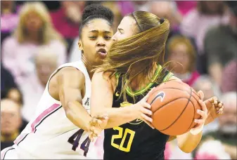  ?? Jessica Hill / Associated Press ?? UConn’s Aubrey Griffin, left, pressures Oregon’s Sabrina Ionescu in the first half on Monday.