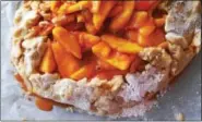  ?? PHOTO BY EMILY RYAN ?? After assembling and before baking, chill this peach crostata for better results.