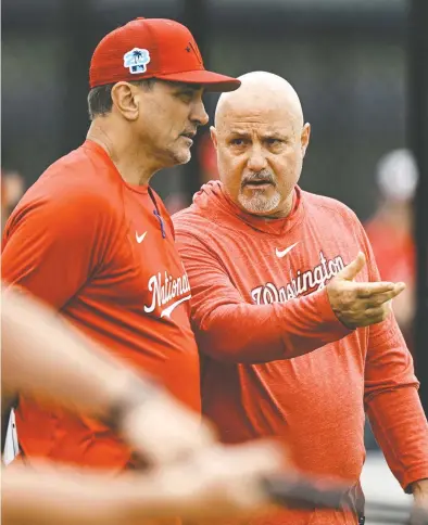  ?? JONATHAN NEWTON/THE WASHINGTON POST ?? The Nationals’ Mike Rizzo, right, said, “This is the most upside group in the minor leagues that we’ve ever had coming up.”