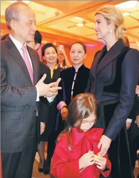  ?? ZHAO HUANXIN / CHINA DAILY ?? Chinese Ambassador Cui Tiankai (left) talks with Ivanka Trump and her daughter, Arabella, during a reception at the Chinese embassy in Washington, DC, on Wednesday.
