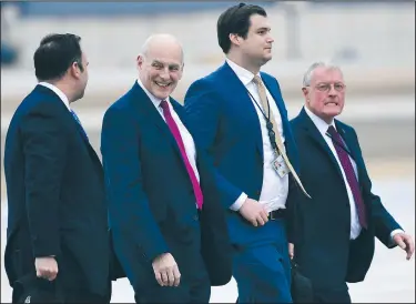 ?? AP/SUSAN WALSH ?? White House staffers (from left) Dan Scavino, director of social media; White House Chief of Staff John F. Kelly; White House aide Ronny Jackson; and National Security Adviser Keith Kellogg walk from Marine One to Air Force One on Friday as they arrive...