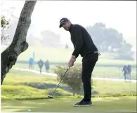  ?? (AP photo/Godofredo A. Vásquez) ?? Aaron Rodgers follows his putt on the 16th green of the Pebble Beach Golf Links Sunday during the third round of the AT&T Pebble Beach Pro-Am golf tournament in Pebble Beach, Calif.