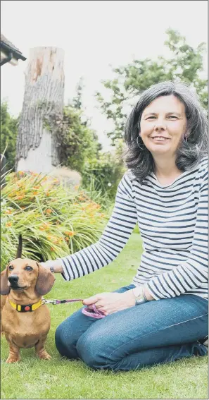  ??  ?? FATAL ATTRACTION: Helen Bailey with her beloved dachshund. Both of their bodies were found in a cesspit after the children’s writer was murdered by her partner in a plot to seize her money and property.