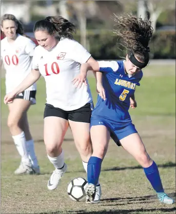  ?? Nikolas Samuels/The Signal ?? Santa Clarita Christian’s Alyssa Hopewell (10) fights for control of the ball against Louisville’s Lila Dubois during a home game at Central Park on Wednesday.