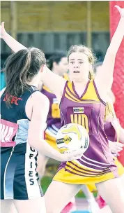  ?? Photograph­s by CRAIG JOHNSON. ?? Drouin’s Lucy McKellar puts great pressure on Sale’s Tori Dessent in A grade. The Hawks jumped into the top five after a 46-34 win.