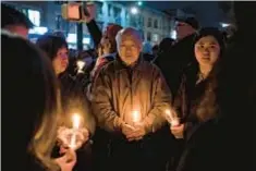  ?? ?? People gather at Bay Ridge Parkway and Fifth Ave. during candleligh­t vigil for victims of last week’s U-Haul truck rampage in Brooklyn.