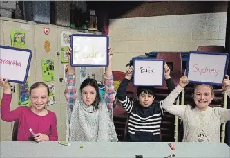  ?? JESSICA NYZNIK EXAMINER ?? Grade 6 students Samantha Wotten, left, Audra McQueen, Erik Dervishi and Sydney Reeson competed in the Great Canadian Geography Challenge at Edmison Heights Public School on Monday. Sydney won first place.