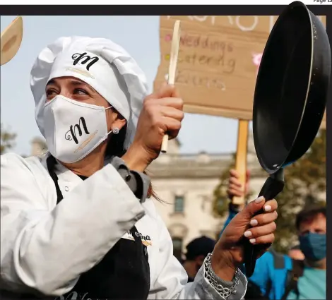  ??  ?? Boiling point: Chef Yotam Ottolenghi at London protest
Pans people: Around 300 hospitalit­y industry workers gathered in Westminste­r to demand extra support