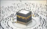  ?? AFP ?? Pilgrims walk around the Kaaba, Islam’s holiest shrine in Saudi Arabia while following social distancing rules.