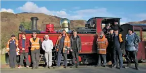  ?? ALL: MICHAEL CHAPMAN ?? Team effort: the delegation­s from the Ffestiniog &amp; Welsh highland and Welsh highland heritage railways, who helped make Russell’s historic test runs happen. F&amp;Whr general Manager paul lewin is stood under the dome, whilst the Whhr’s Mark seale – who is project managing the joint event next year – is standing to the right on Russell’s footplate.