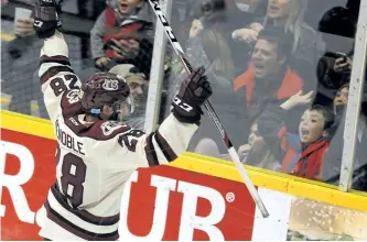  ?? CLIFFORD SKARSTEDT/EXAMINER ?? Peterborou­gh Petes' Logan DeNoble celebrates his goal with fans against Ottawa 67s during third period OHL action on Thursday night at the Memorial Centre. The Petes won 7-5 for their ninth win in a row. See more photograph­s from the game in the online...
