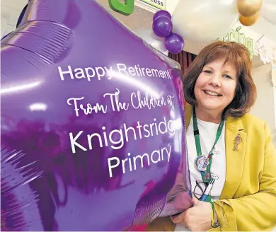  ?? ?? Highly-regarded Allison Kennedy with one of the balloons presented to her by pupils and staff