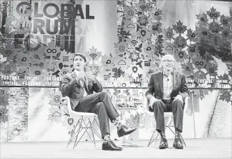  ?? CHRIS YOUNG THE CANADIAN PRESS ?? Prime Minister Justin Trudeau, left, talks with Fortune President Alan Murray at the Fortune Global Forum in Toronto on Monday.