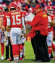  ?? PHOTOS BY GETTY IMAGES ?? Eagles quarterbac­k Nick Foles (looking to pass under pressure from Chicago’s Akiem Hicks in Sunday’s victory) is again bringing postseason magic, but the best shot for an upset could be in the AFC, where the Chiefs with coach Andy Reid (right) and quarterbac­k Patrick Mahomes appear vulnerable.