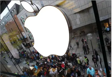  ?? (AP file photo) ?? People wait in front of an Apple store in Munich before the worldwide launch of the iPhone 6s in 2015. European regulators have been trying to crack down on what they believe is anti-competitiv­e behavior by the world’s largest technology companies. Video is available at arkansason­line.com/716eu/.