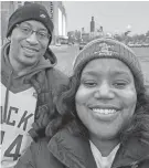  ?? TANZANIQUE CARRINGTON ?? Keith and Tanzanique Carrington take a photo together in Milwaukee Bucks gear. Keith, the principal at North Division, died Monday afternoon at age 48.