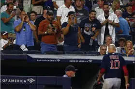  ?? ADAM HUNGER - THE ASSOCIATED PRESS ?? Fans yell at Boston Red Sox pitcher David Price (10) as heads for the dugout during the third inning of a baseball game against the New York Yankees on Sunday, Aug. 4, 2019, in New York.