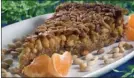  ?? The Associated Press ?? Finish off your meal with a dessert like this orange-honey pine nut tart that can be made earlier in the day.