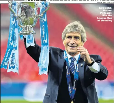  ?? Picture: BEN STANSALL ?? SUCCESS: Manuel Pellegrini lifts the League Cup at Wembley