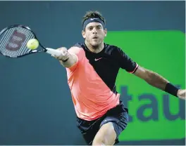  ?? WILFREDO LEE, THE ASSOCIATED PRESS ?? Juan Martin del Potro hits a return to Milos Raonic during their quarter-final match at the Miami Open on Wednesday.