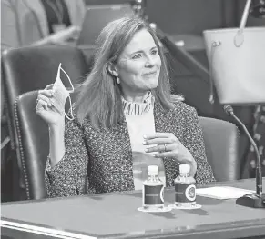  ?? HANNAH GABER/ USA TODAY ?? Judge Amy Coney Barrett enters the hearing room on the third day of Senate Judiciary Committee confirmation hearings.