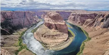  ??  ?? This remarkable panoramic shot captures the Horseshoe Bend of the mighty Colorado River near Page, Ariz.