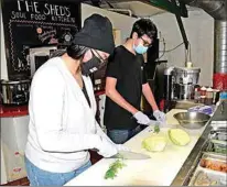  ?? NICK SMIRNOFF / FOR TEHACHAPI NEWS ?? Both Layla and Milo Lujan prepare the vegetables and ingredient­s for the soup.