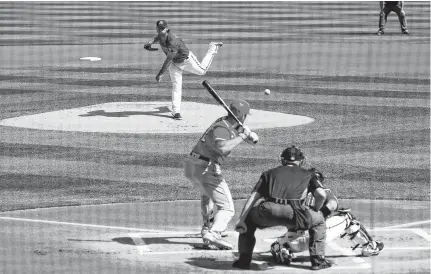  ?? ROB SCHUMACHER • ARIZONA REPUBLIC VIA USA TODAY NETWORK ?? Arizona Diamondbac­ks pitcher Madison Bumgarner throws to Cincinnati Reds' Curt Casali during a spring training game in Scottsdale, Ariz., on Feb. 27.