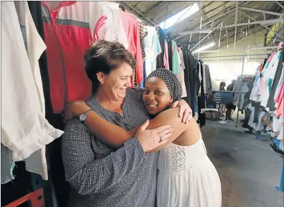  ?? Picture: SIBONGILE NGALWA Picture: ALAN EASON ?? EMBRACING CHANGE: Clothing Bank national co-founder and CEO Tracey Chambers gets a hug from previously unemployed Andiswa Bakada, who now makes between R4 000 and R7 000 a month