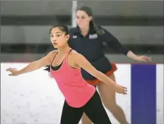  ?? Peter Diana/Post-Gazette ?? Alexis Ky practices synchroniz­ed skating June 26 at the RMU Island Sports Center in Neville Island.