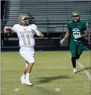  ?? TIM GODBEE / For the Calhoun Times ?? Calhoun’s Gavin Gray (11) scrambles to make a throw downfield during the first half.