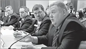  ?? Associated Press ?? Prosecutin­g attorneys, from left, Scott Ellington, Bob McMahan and Henry Boyce listen as fellow prosecutor Tom Tatum speaks Wednesday during a meeting of the Senate Judiciary Committee at the Arkansas state Capitol in Little Rock. The four appeared in...