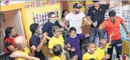  ??  ?? Sunrisers Hyderabad team members Yuvraj Singh, VVS Laxman, Ashish Nehra, Tom Moody, Rashid Khan, Bhuvaneshw­ar Kumar and Ben Cutting dance with cancer affected children at St. Jude India ChildCare center in Hyderabad on Friday.